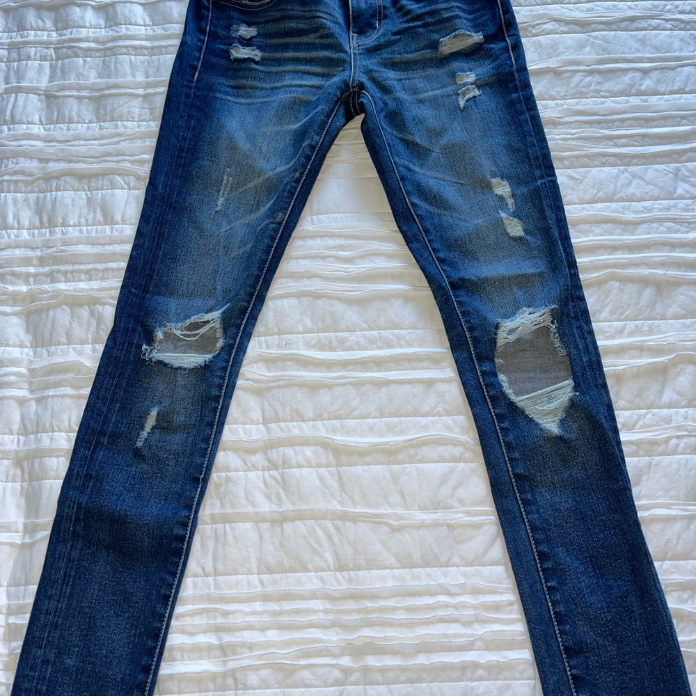 Buckle Black Distressed Blue Jeans